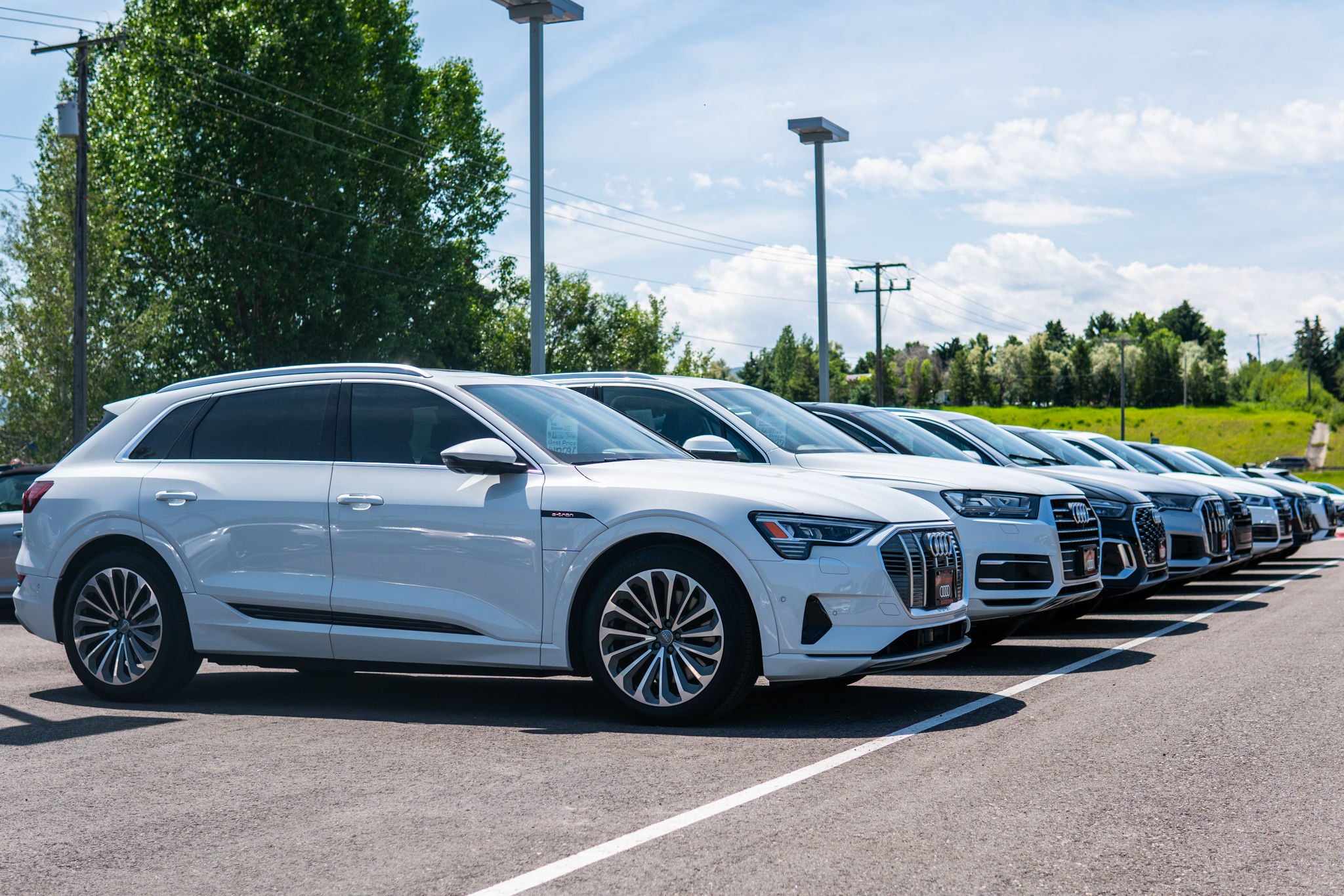 Audi Bozeman Audi Car Dealer lot of white and black used Audi Q7, Q8's and more.